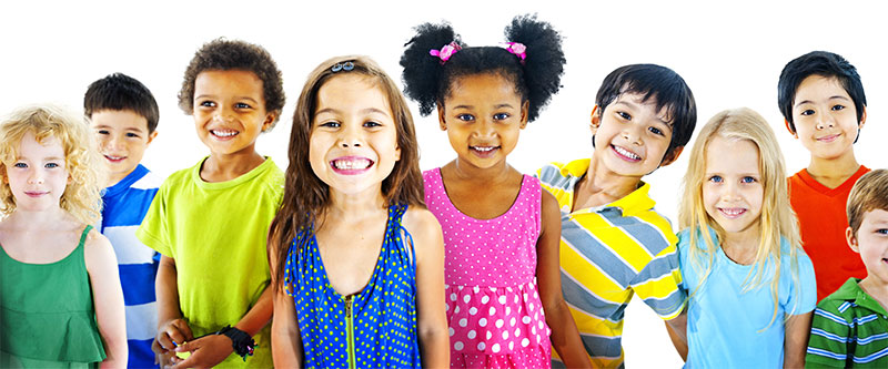 A colorful group of children and adults posing for a photo, with various expressions and attire.